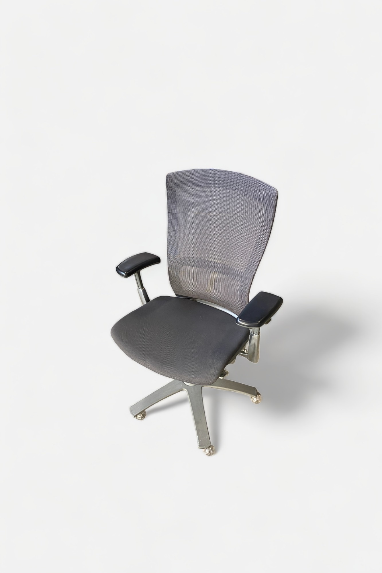 Knoll Adjustable dark grey office chair on wheels with a mesh back