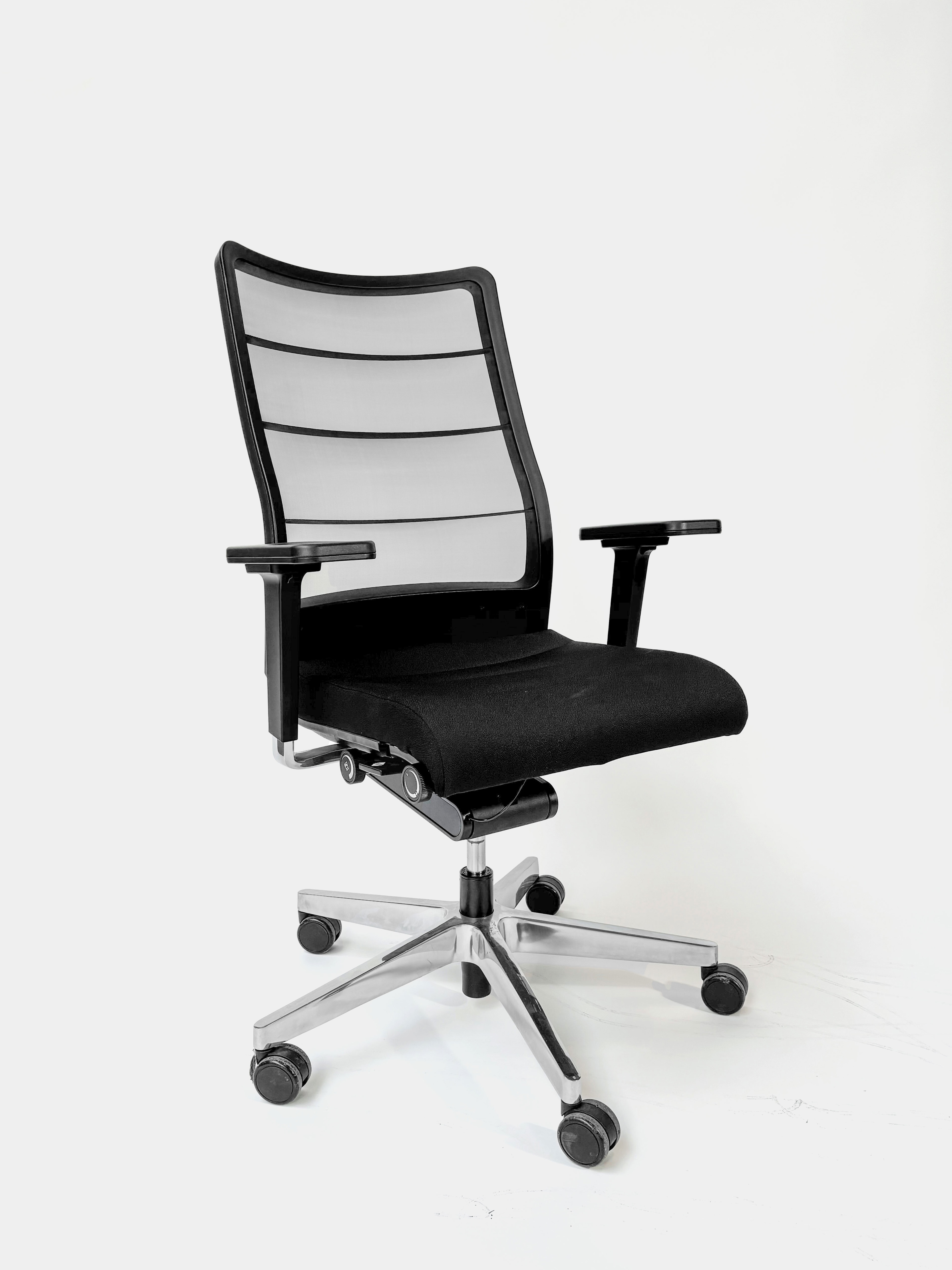 INTERSTUHL Adjustable black office chair with mesh back on wheels