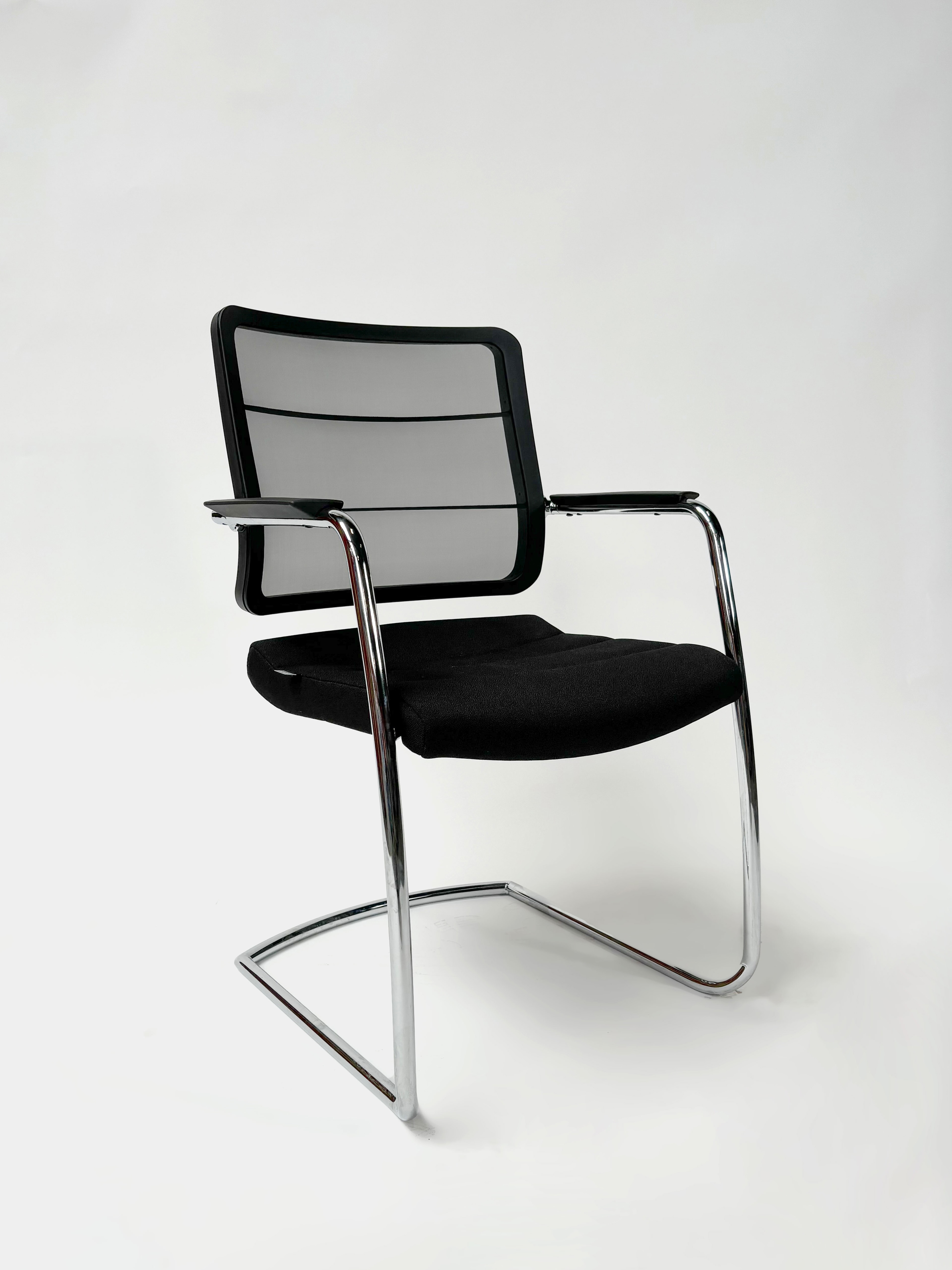 INTERSTUHL Black cushioned chair with mesh back