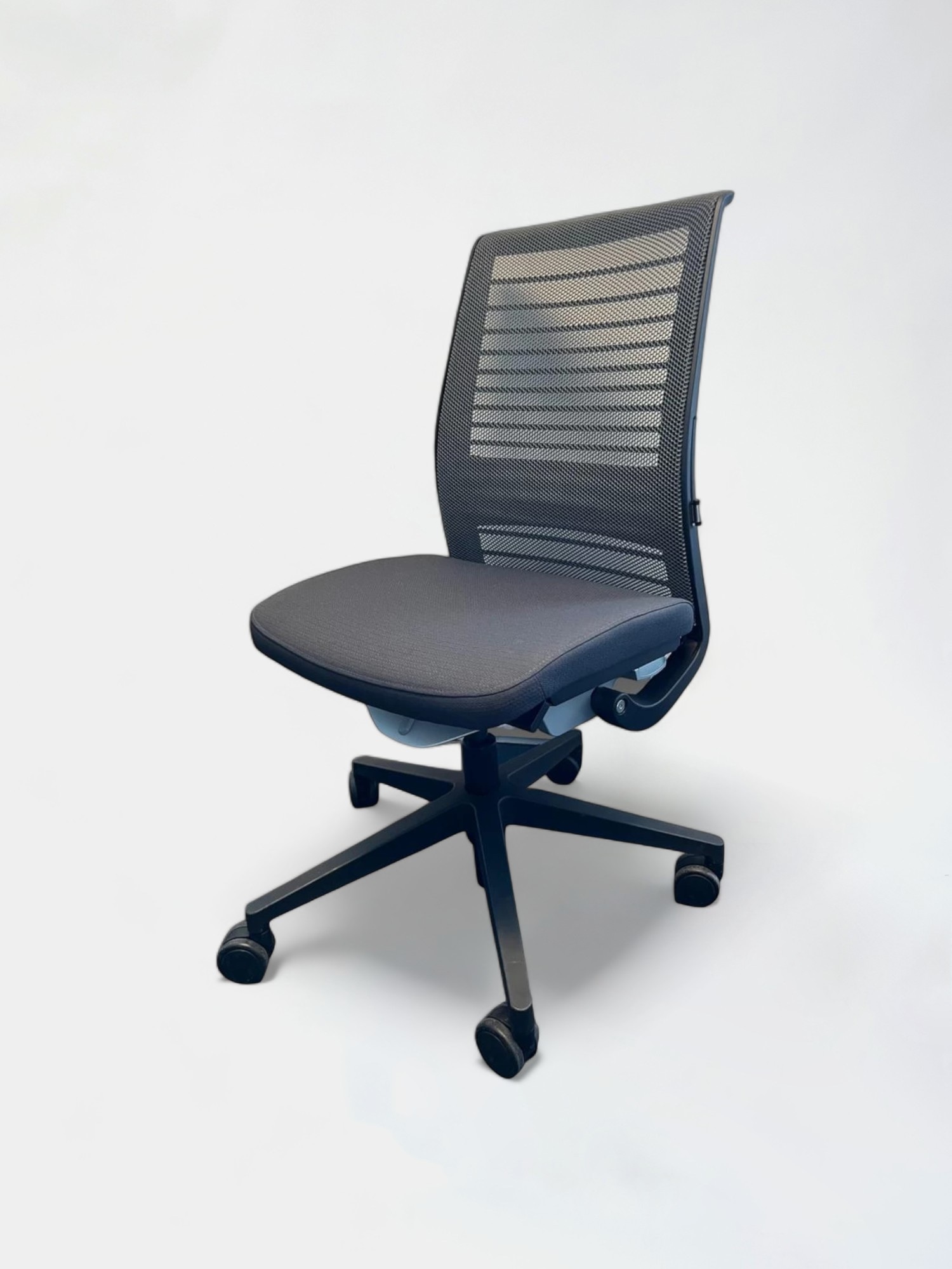 Steelcase Think V2 Black office chair with mesh back without armrests on wheels