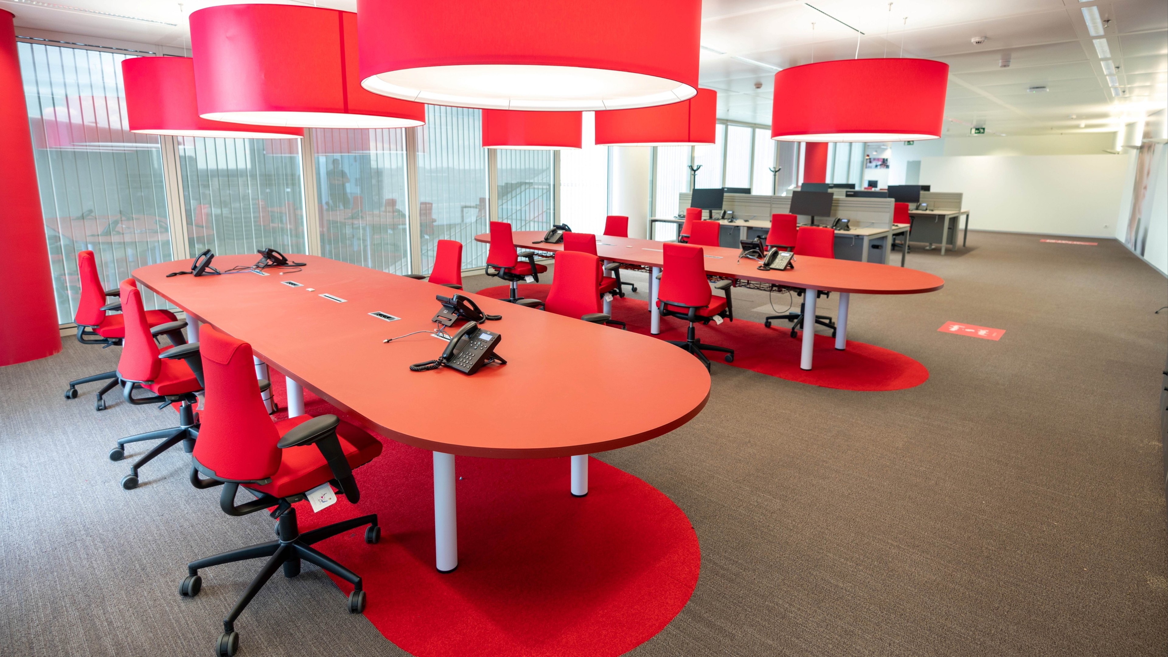 Large oval red Meeting Table with cable top access and undertable rack