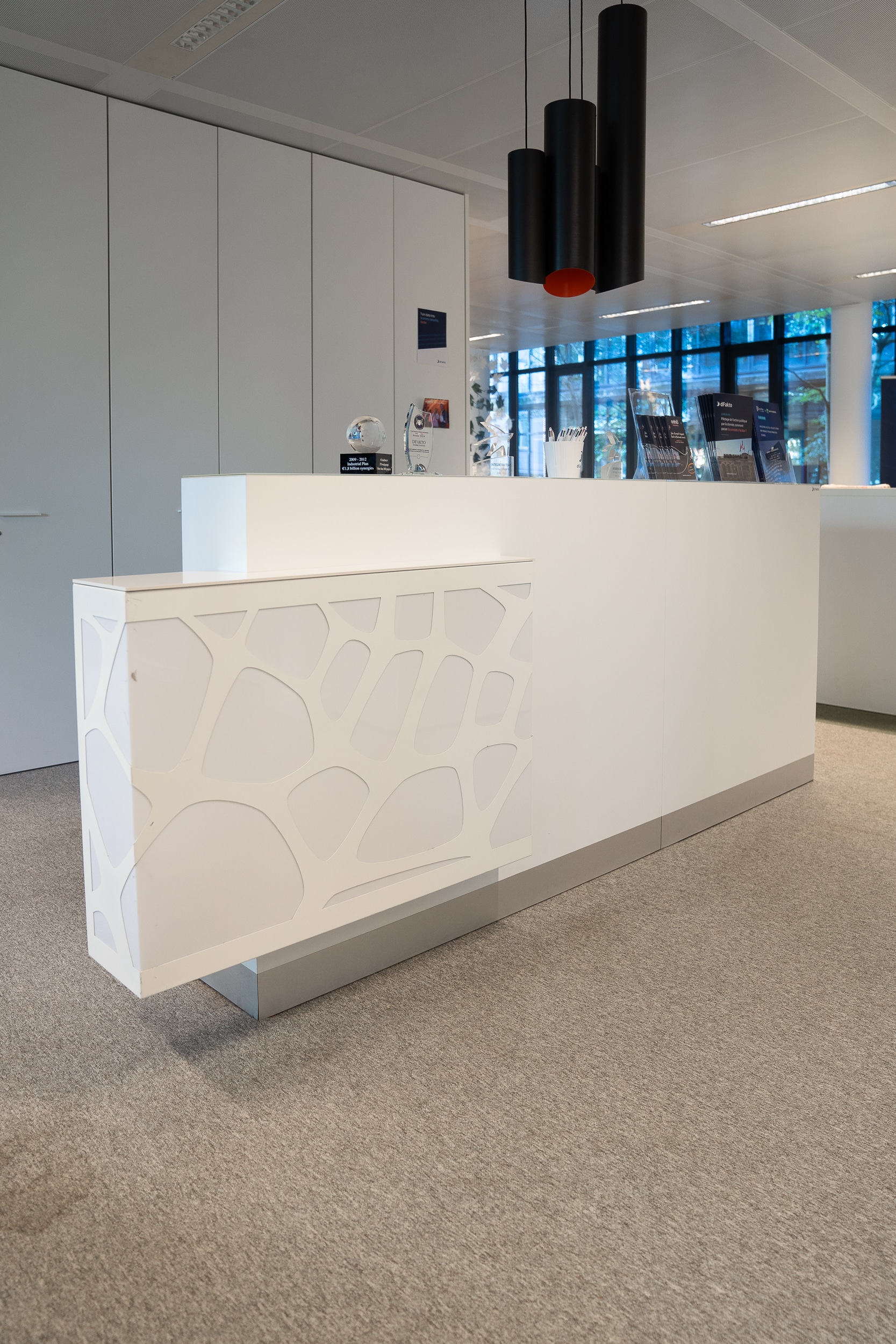 White Modern Reception Desk with Geometric Panel Design