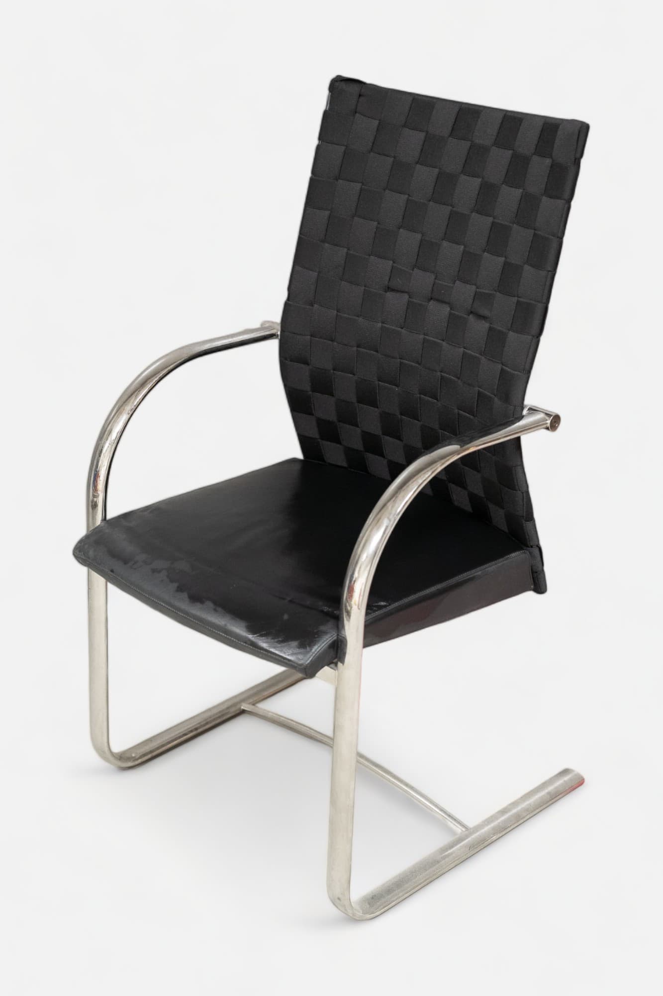 Dietiker black design chair with steel legs