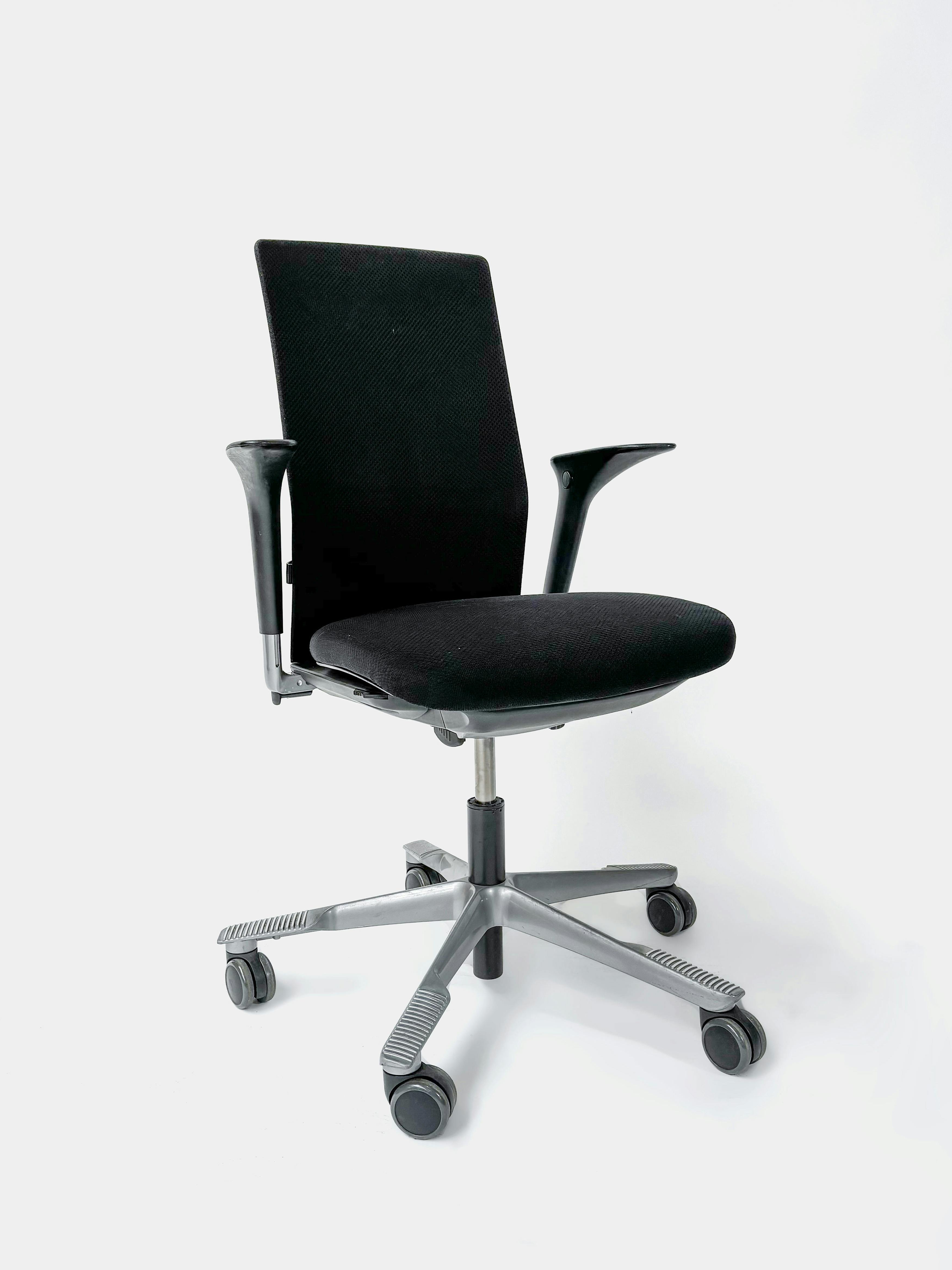 HAG black office chairs on wheels - Relieve Furniture