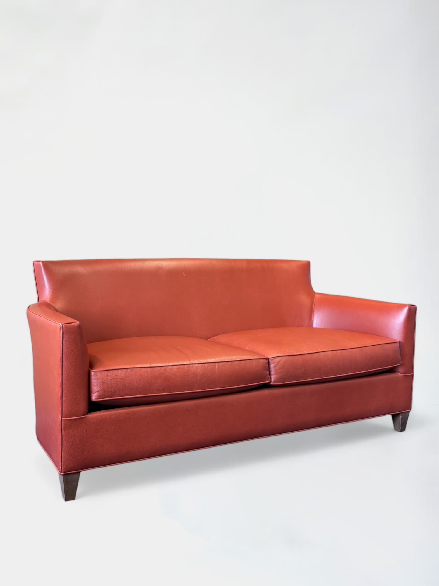 Orange Leather Sofa with Streamlined Modern Design