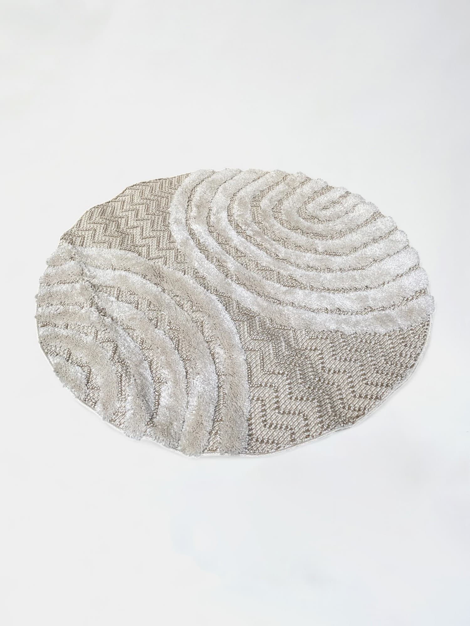 Tapis rond en tissu beige à motif texturé