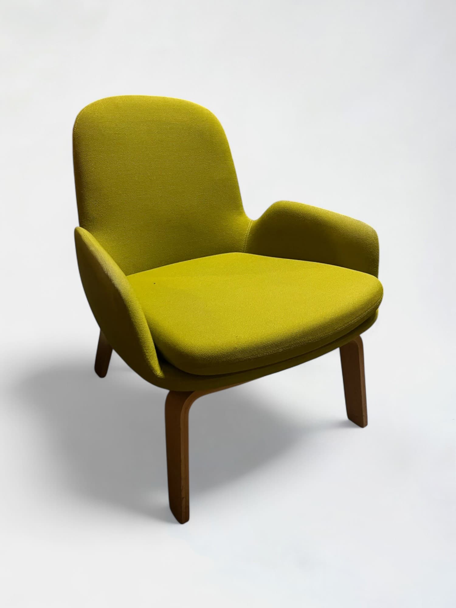 Normann light kaki green low armchair with wooden legs