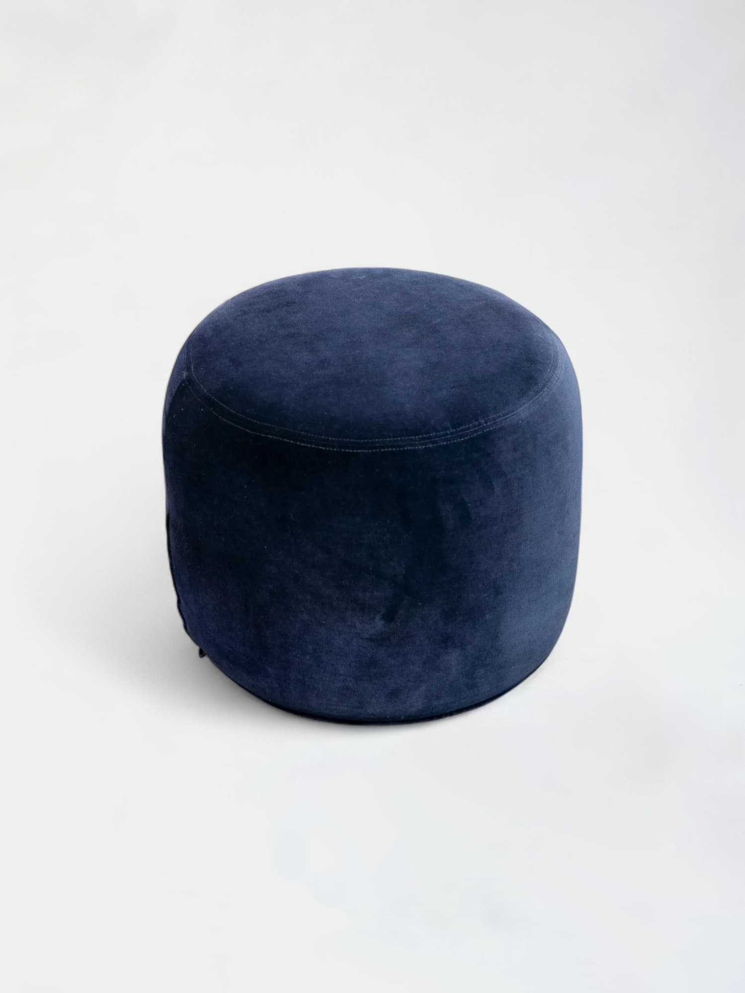 Round navy blue velvet pouf