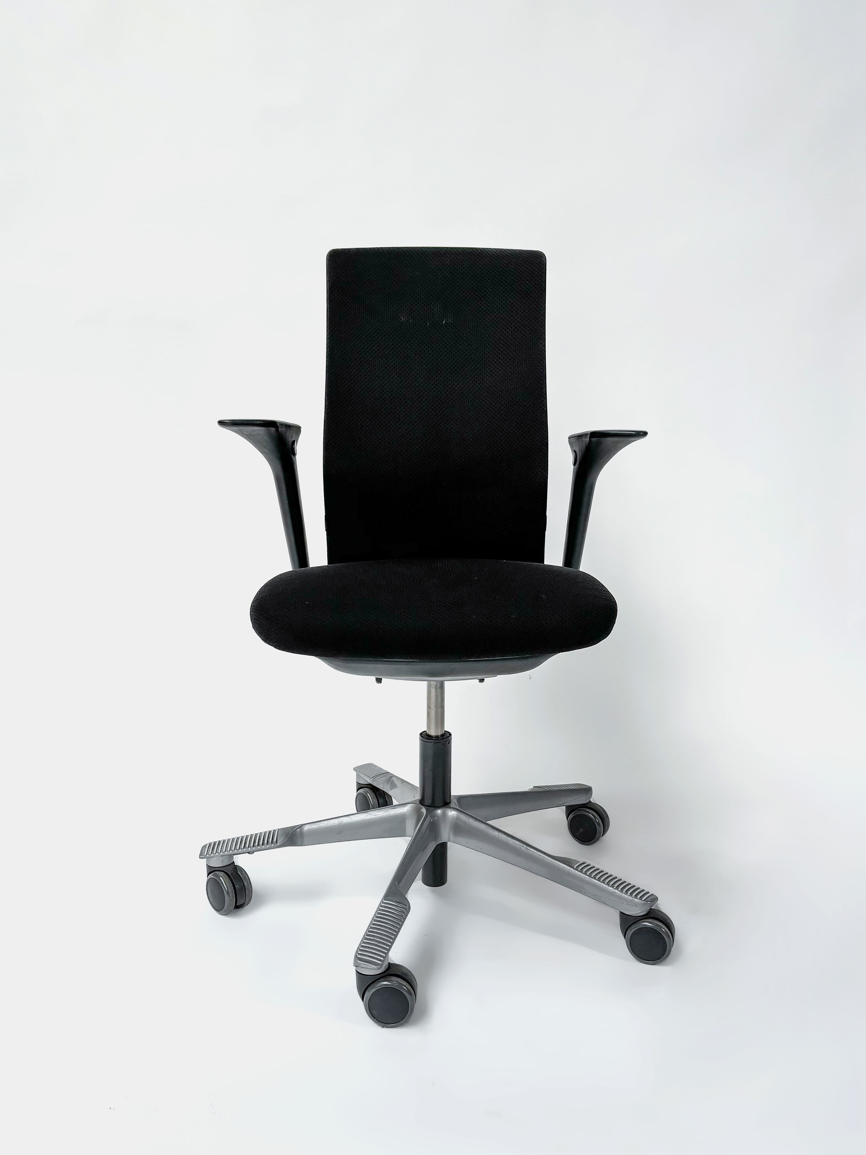 HAG Adjustable black office chairs on wheels