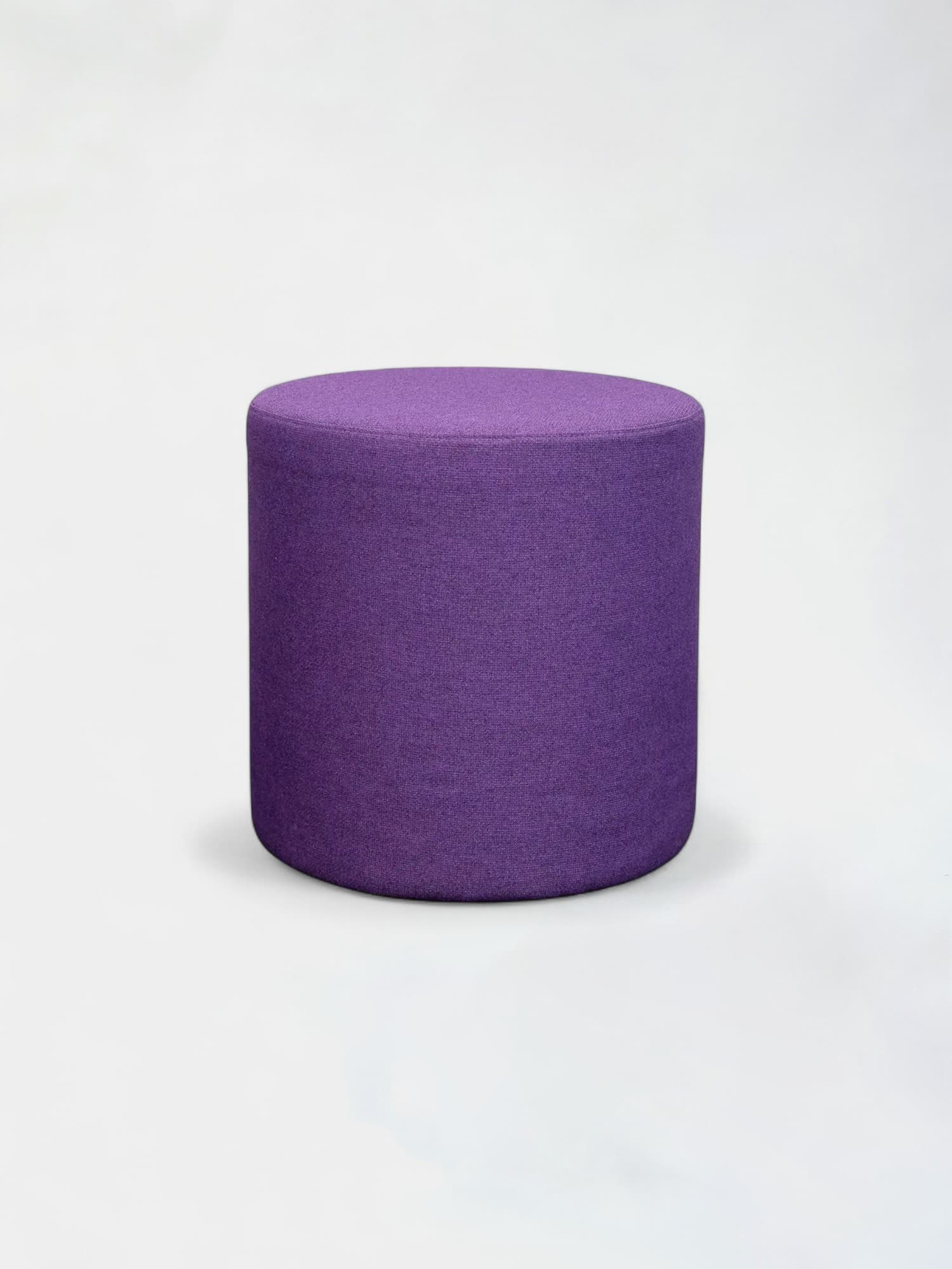 Round dark mauve pouffe
