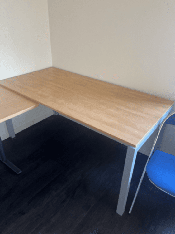 Laminate wooden simple table on grey legs