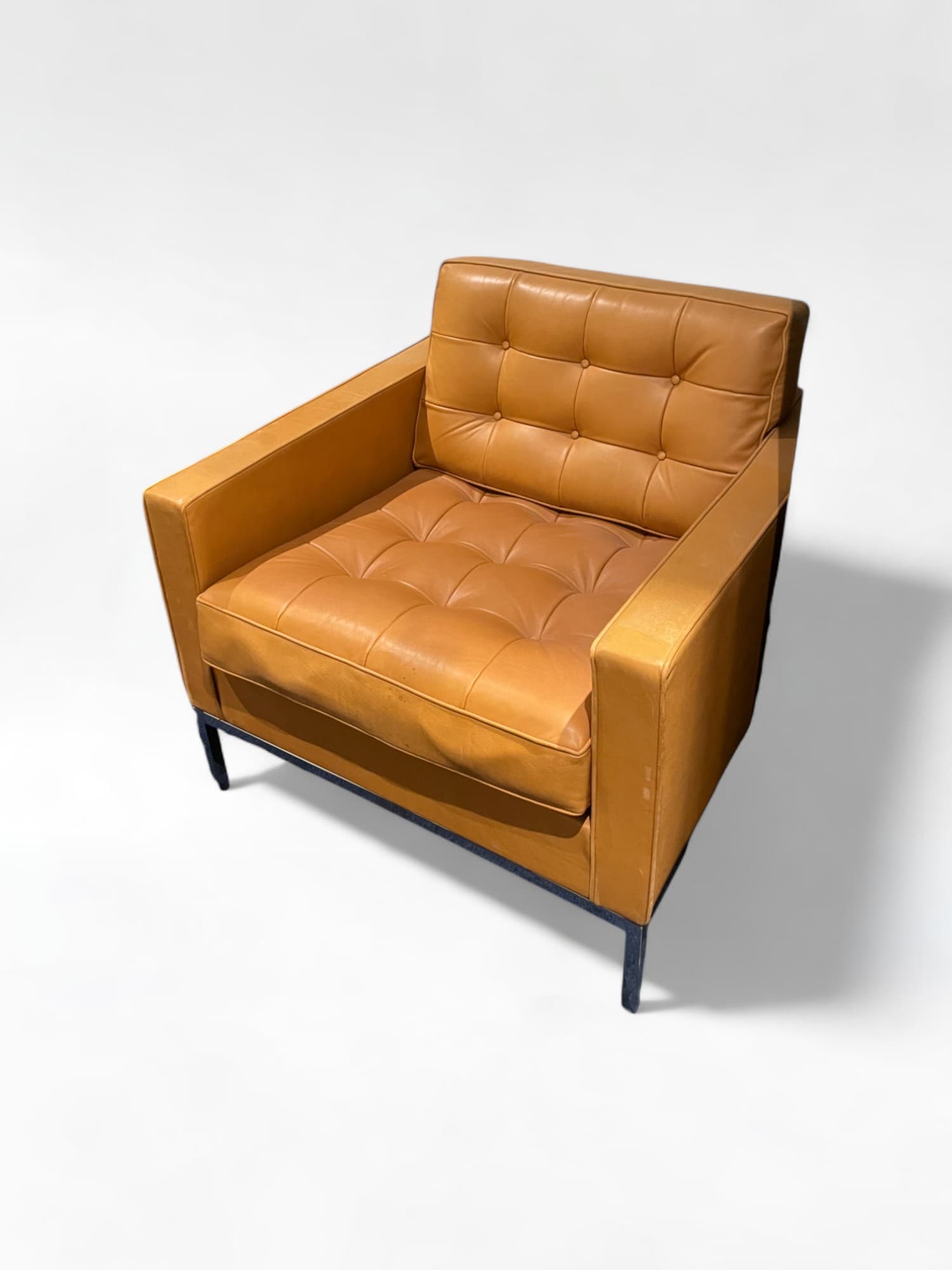 The Florence Knoll camel armchair original with some signs of use
