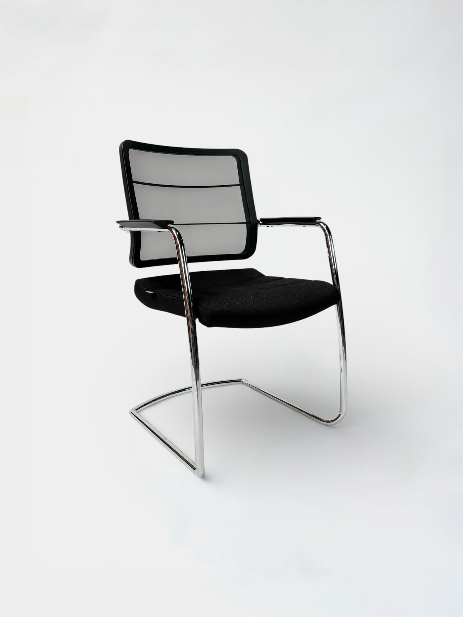 INTERSTUHL Black cushioned chair with mesh back