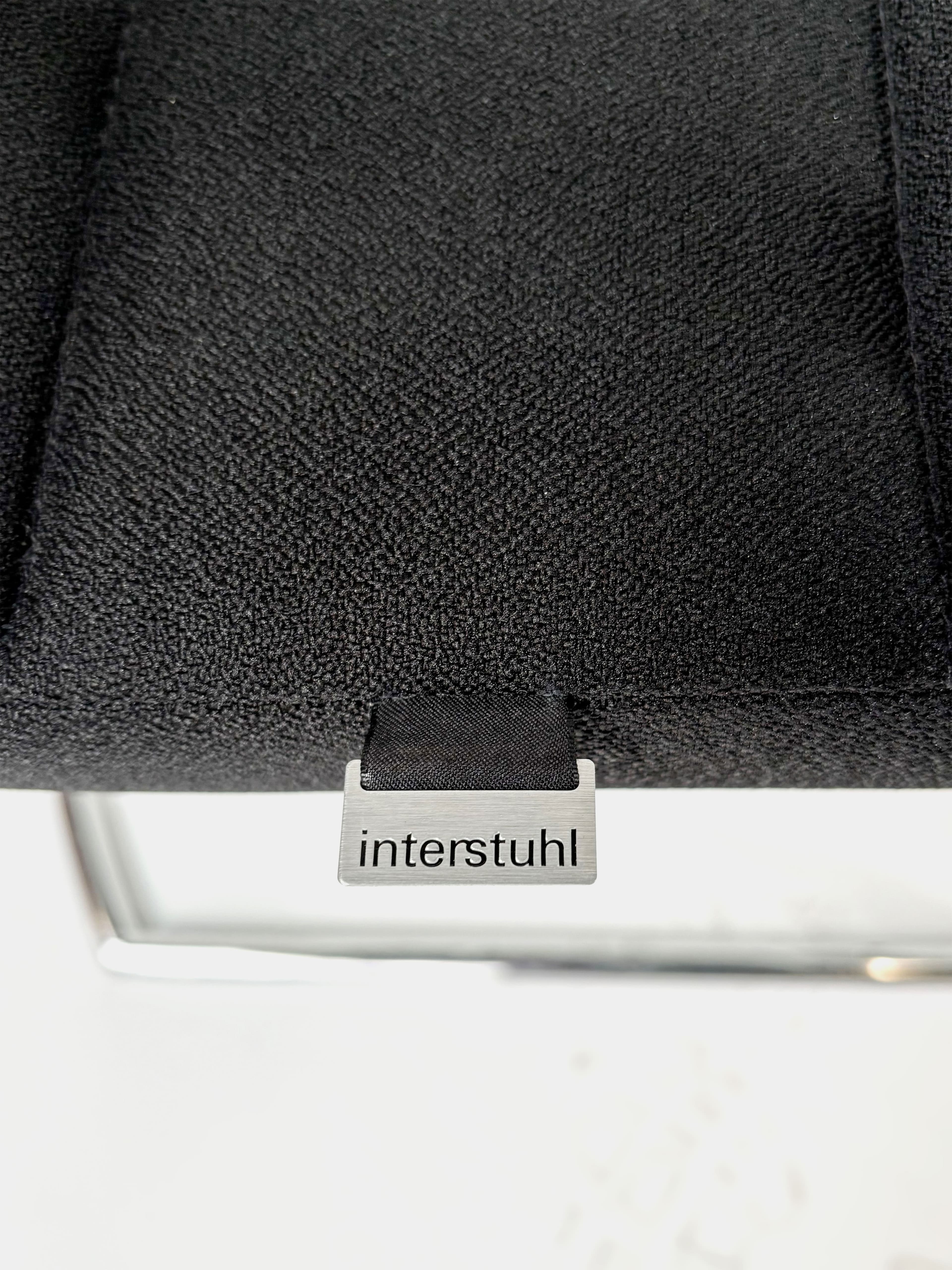 INTERSTUHL Black cushioned chair with mesh back