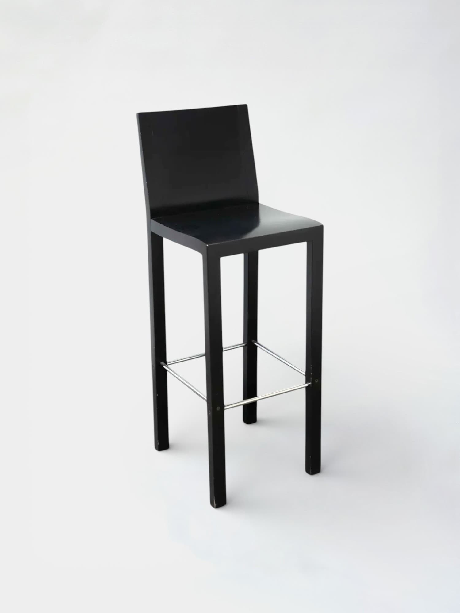 Dietiker black wooden stool with metal footrests