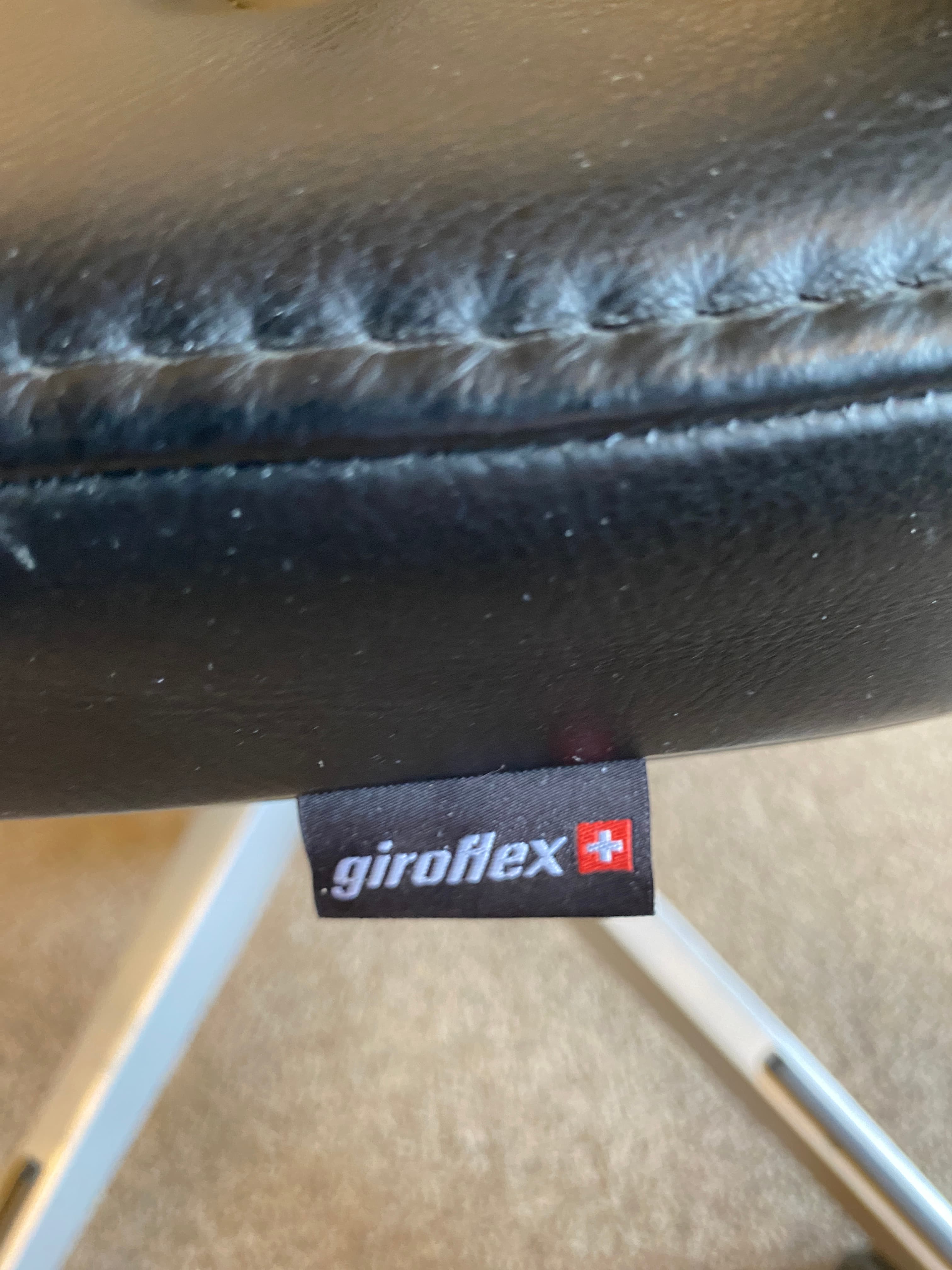 Giroflex grey mesh back with black leather seating office chair with grey plastic structure
